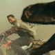 Chris Pratt being chased by a dinosaur.